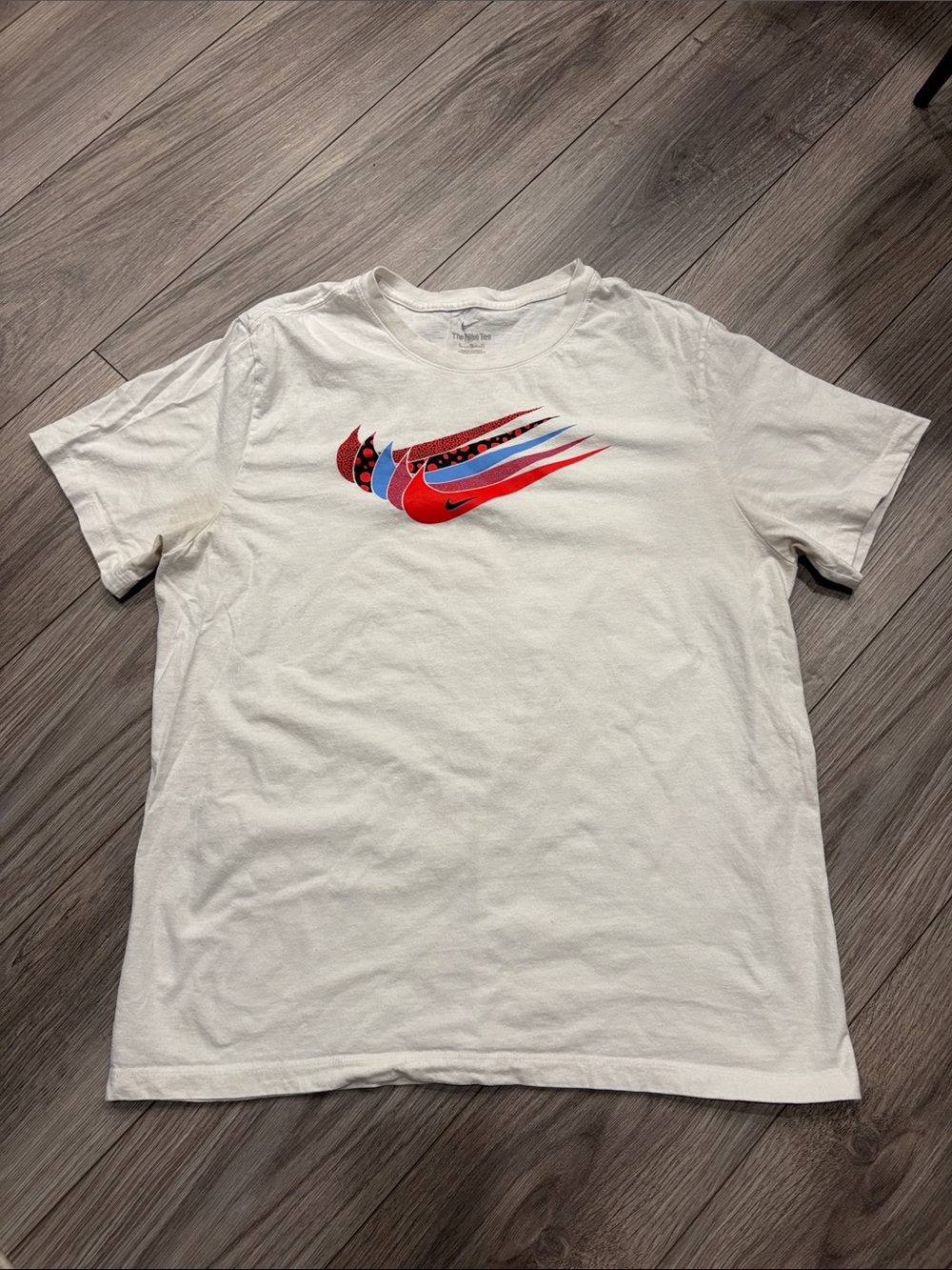 Nike White Short-Sleeve Graphic Tee with Red and Blue Swoosh